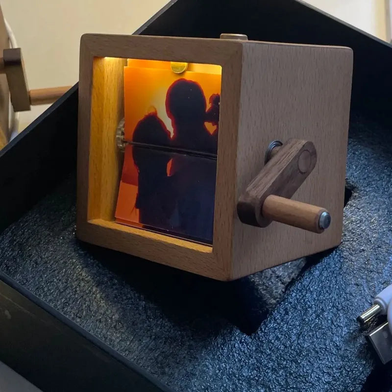 Hand-cranked photo album with light